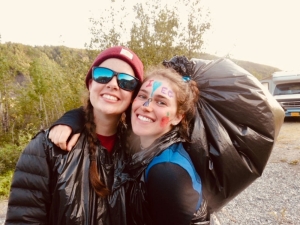 Two teen girls smiling in Alaska during a summer outdoor adventure camp