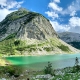 pretty green alpine lake in the mountains of slovenia