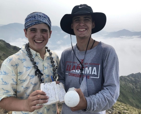 teen boys smiling after summiting denali in alaska