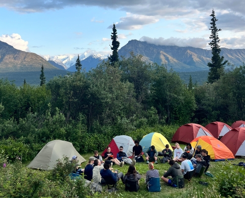 Alaska-kids-in-circle-at-camp-with-tents Alaska-kids-in-circle-at-camp-with-tents
