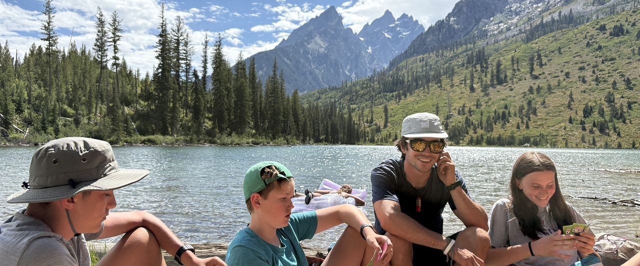 teens at summer camp in yellowstone playing cards teens at summer camp in yellowstone playing cards