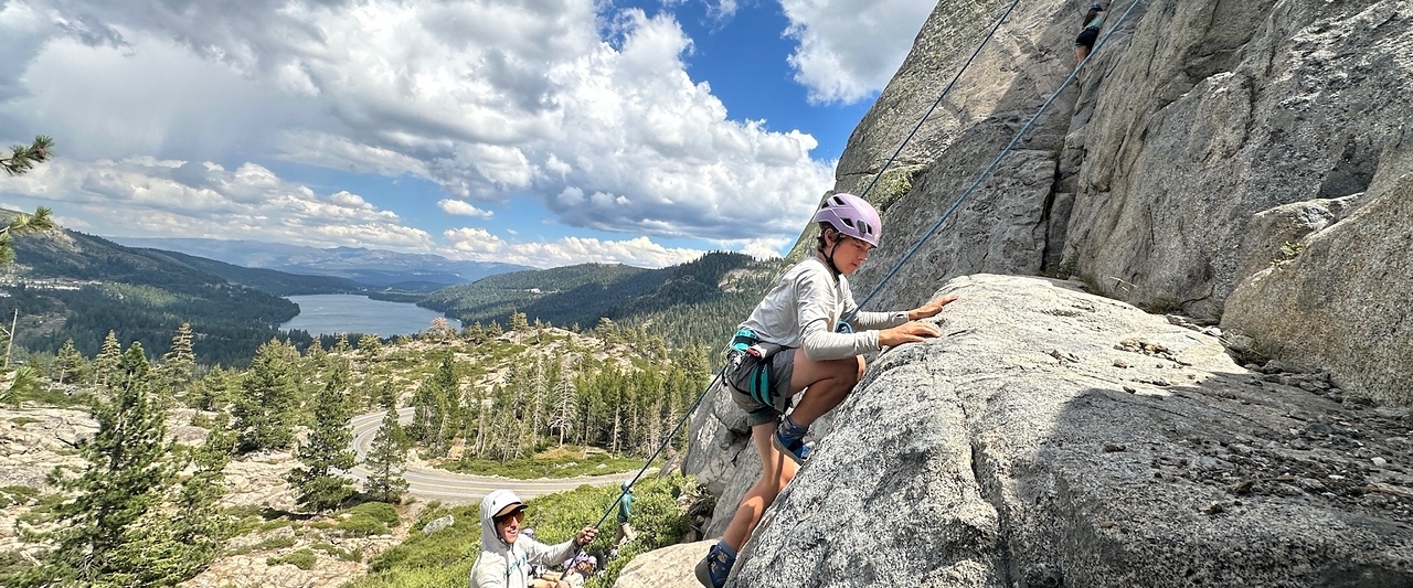 teen boy rock climbing at summer camp california teen boy rock climbing at summer camp in california