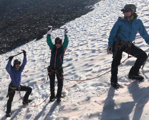 teens ice climbing at summer adventure camp teens ice climbing at summer adventure camp