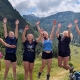 Teen girls jumping in the air to celebrate a hike in Slovenia's Triglav National Park